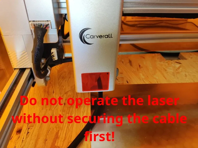 Unsecured Carverall X1Pro laser cable near the working area