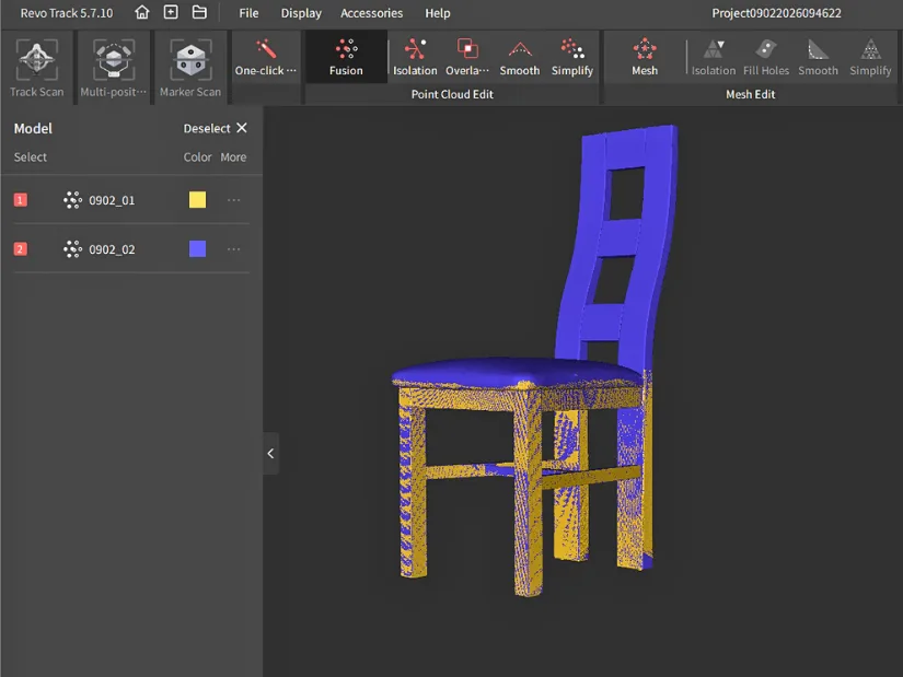 Two chair scans aligned in Revo Track using feature alignment, shown in different colors to demonstrate the overlap.
