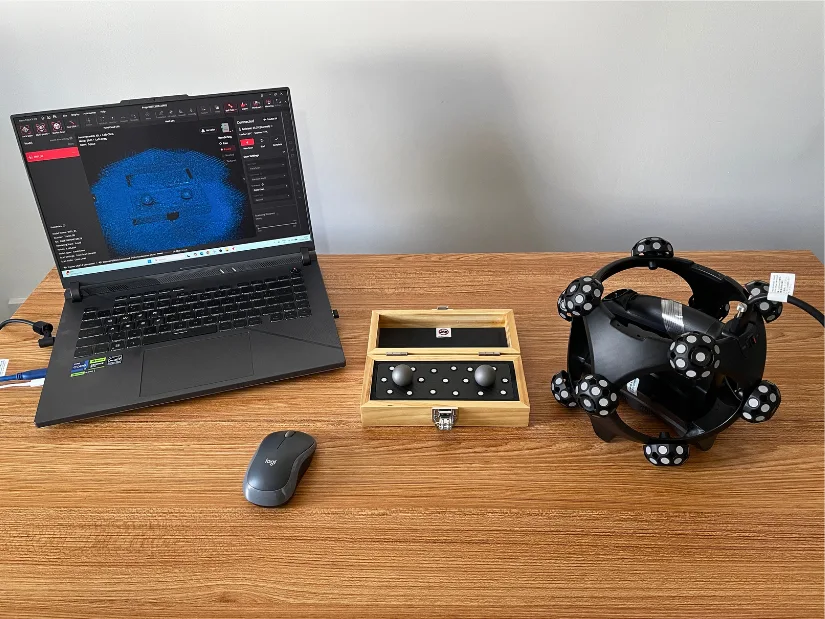 Revopoint Trackit SR CMM Edition setup with ball plate, scanner, and Revo Track software during an accuracy measurement test.