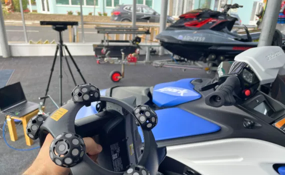 Revopoint Trackit SR 3D scanner being used to scan a Sea-Doo jet ski during hands-on field testing.