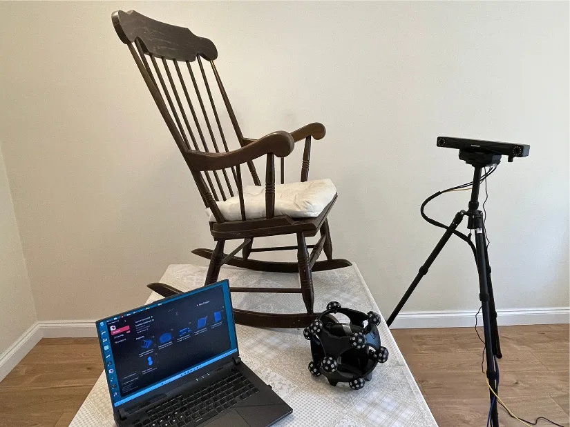 Revopoint Trackit SR setup for scanning a wooden swing chair with the optical tracker and laptop.