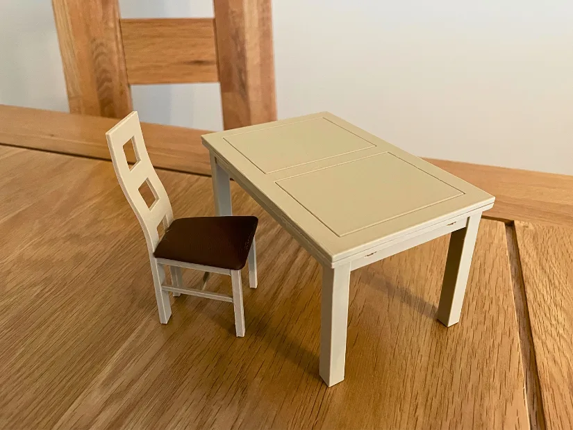 10% scale 3D printed miniatures of a scanned dining table and chair created from Revopoint Trackit SR scans.