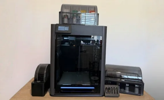 The Bambu Lab H2C and connected filament-handling equipment in my workspace.