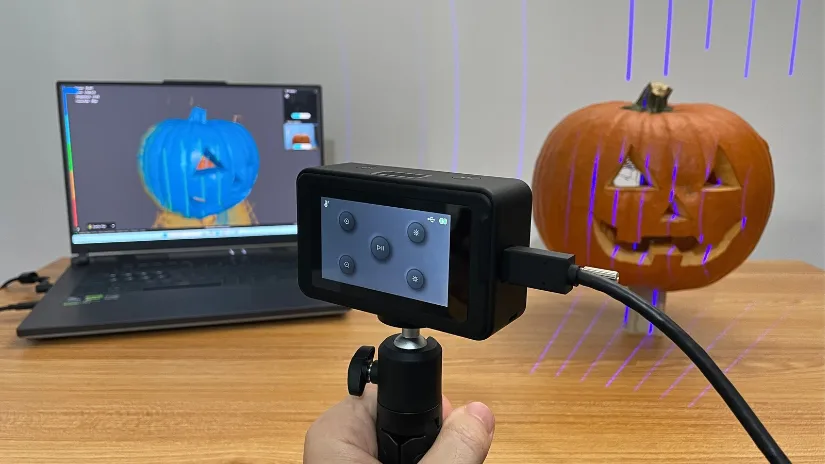 Creality Pika 3D scanner using blue laser mode to scan a carved pumpkin