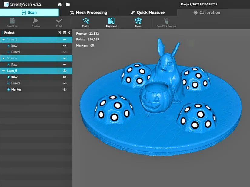CrealityScan showing a completed blue laser scan of a small Halloween miniature using marker towers
