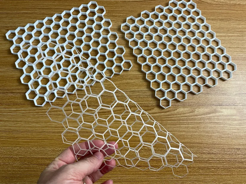 White eSUN PETG Honeycomb Storage Wall sections with a thin PLA separation layer from a stacked print