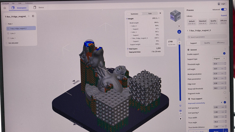 SnowPath slicer preview showing metal 3D printed models and generated supports