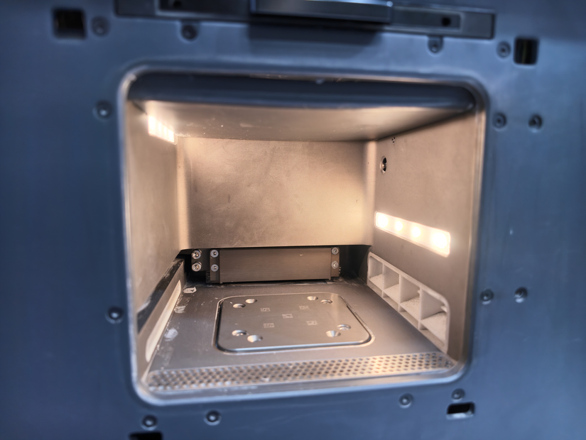 Inside the SnowPod metal 3D printer build chamber with build plate