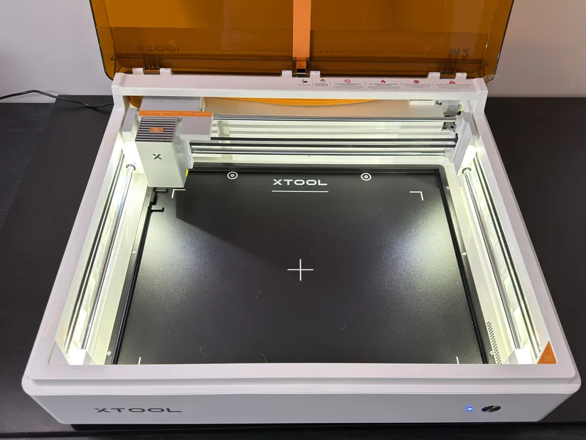 Open xTool M2 revealing the laser cutting and engraving workspace