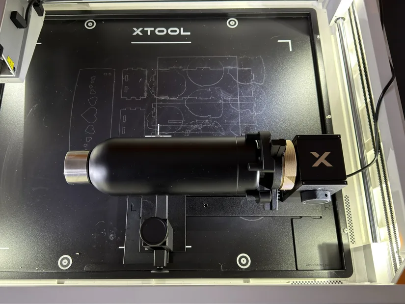 Tumbler mounted in the xTool RA3 rotary attachment inside the M2