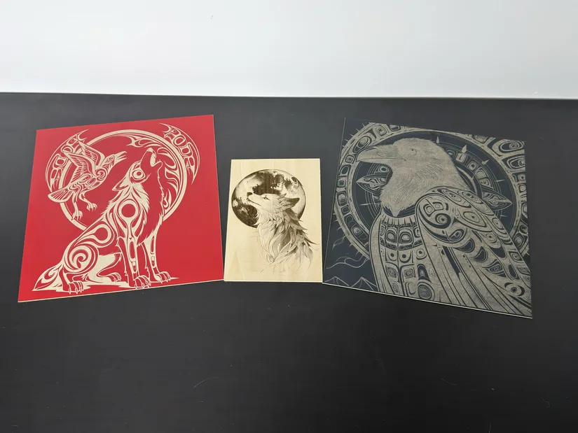 Completed xTool M2 laser engravings on coloured MDF and wood